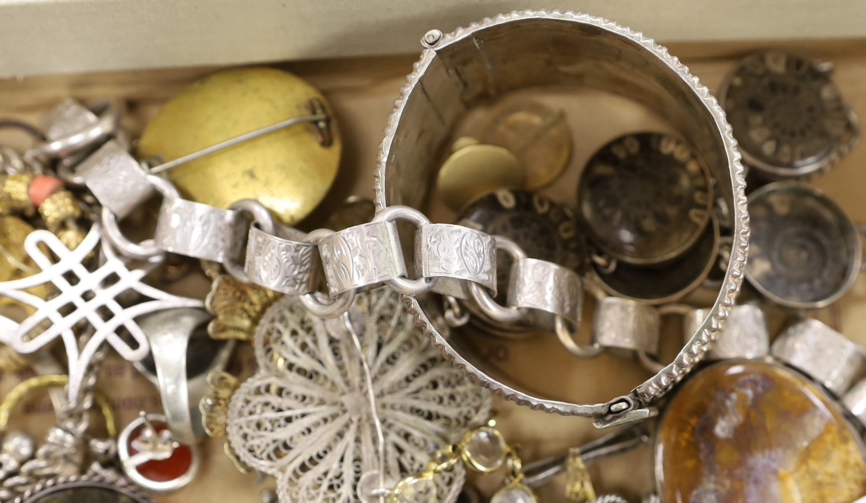 A collection of assorted 19th century and later jewellery, including Middle Eastern white metal canister in chain, yellow metal eat studs and other items including rings, toothpick, necklaces, silver stamp case etc.